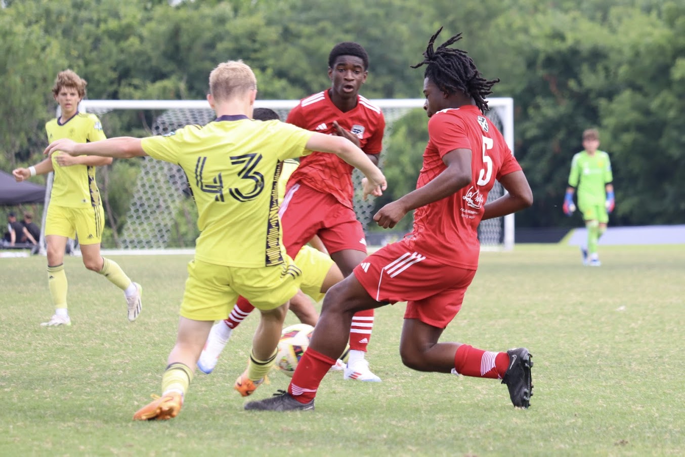 Nehemiah Ardayfio defending the soccer ball against openent at MLS league soccer match
